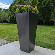 Trough planters arranged in a cascading formation.